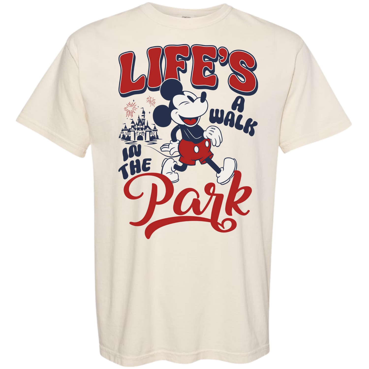 Cream t-shirt with classic mouse character, castle, fireworks, and 'Life's a Walk in the Park' text.