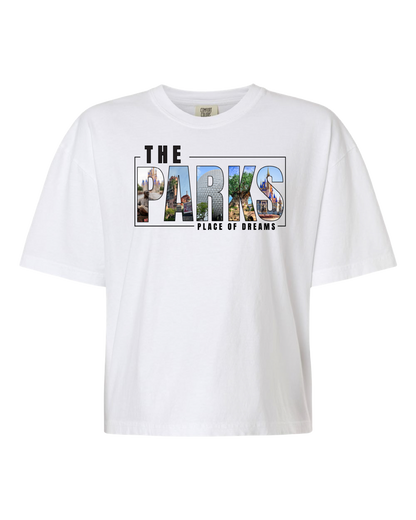White t-shirt with 'The Parks Place of Dreams' and theme park graphic lettering design