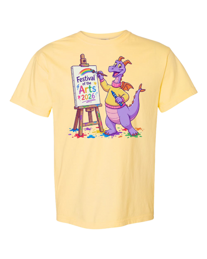 Yellow t-shirt with cartoon purple dragon painting 'Festival of the Arts 2026' on easel