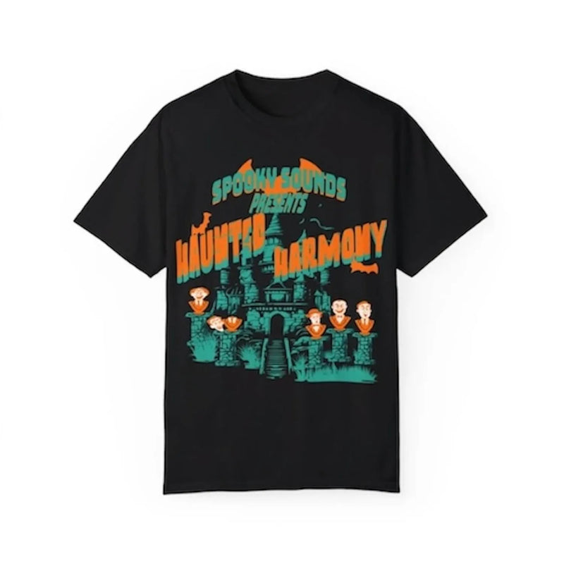 Black t-shirt with cartoon haunted mansion, singing busts, and text 'Haunted Harmony' in orange and green.