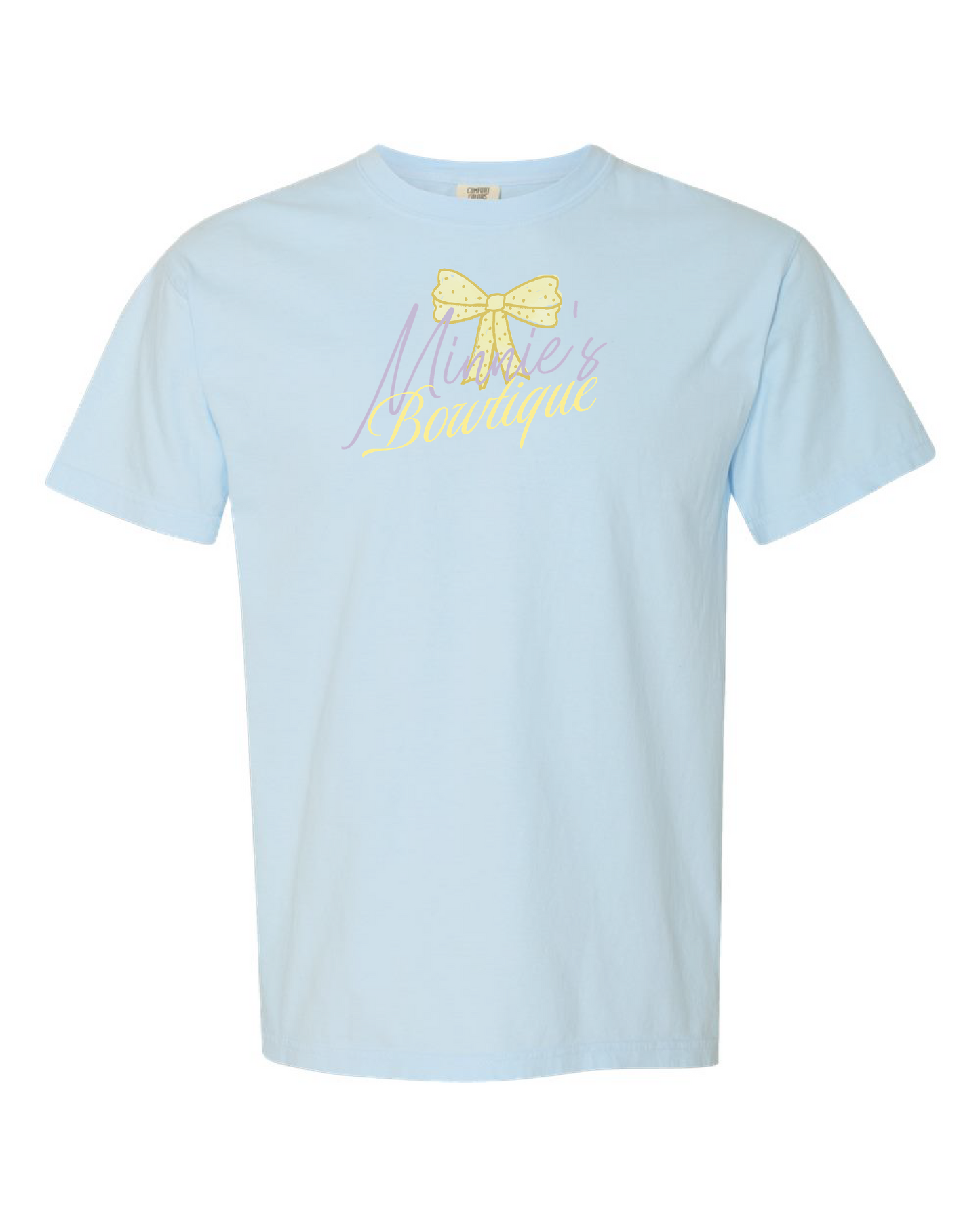 Light blue shirt with yellow polka dot bow and 'Minnie's Boutique' text on front