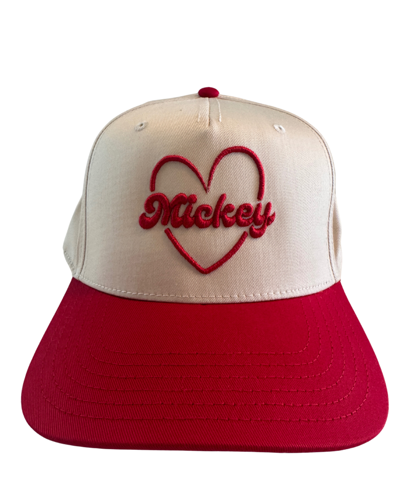 Cream and red snapback hat with embroidered red heart and Mickey text on front