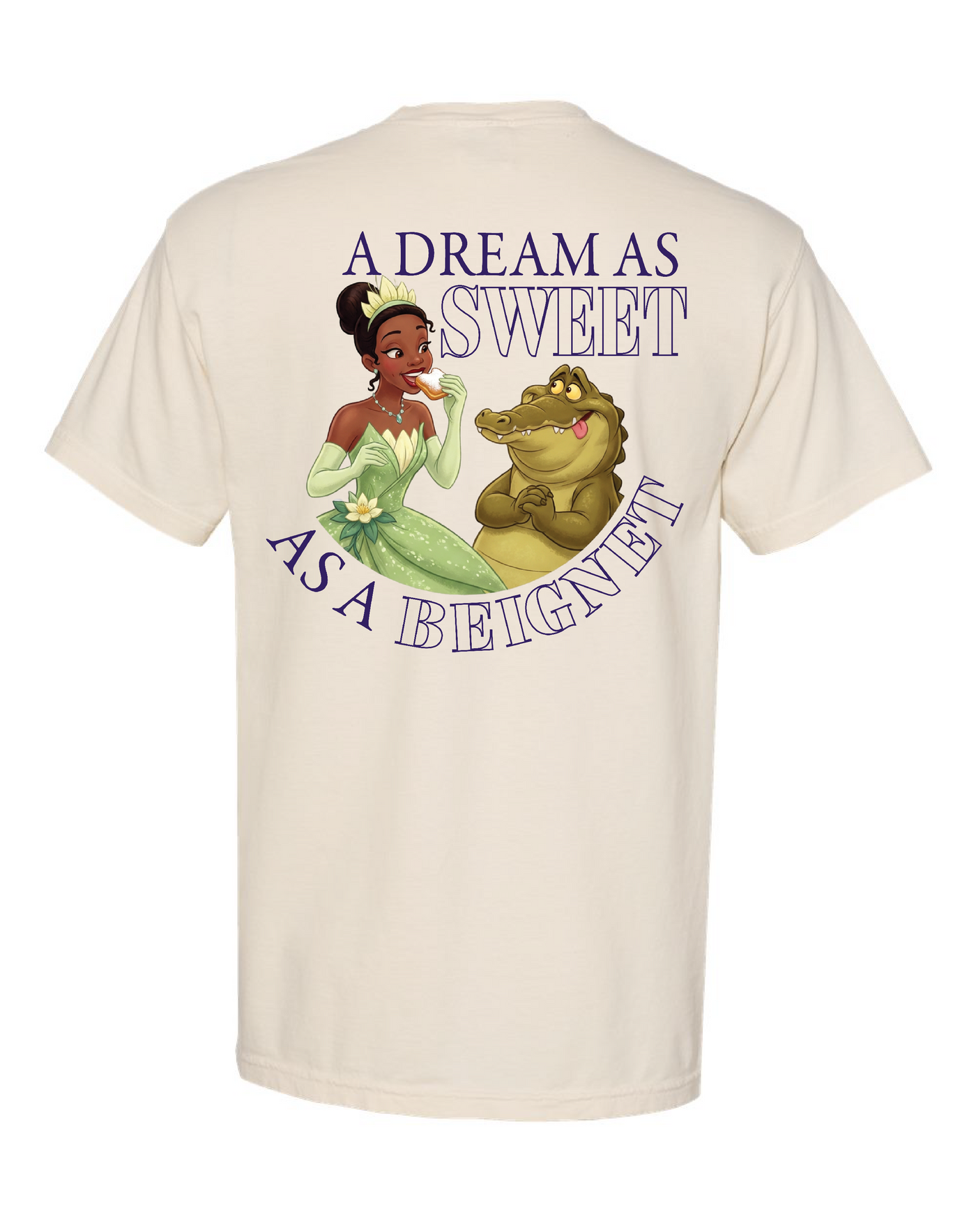 Cream t-shirt with illustrated princess and alligator, text reads 'A Dream As Sweet As A Beignet'