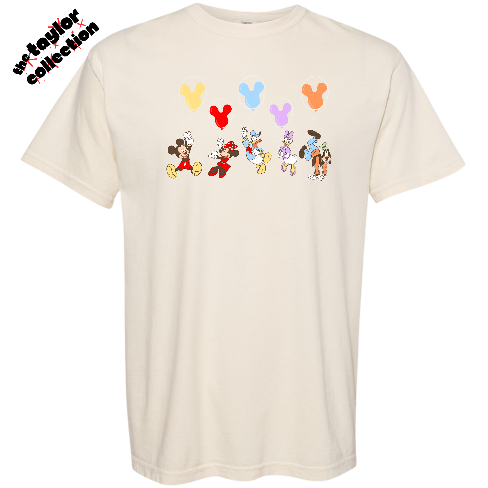Beige t-shirt with cartoon character designs and balloons on a white background