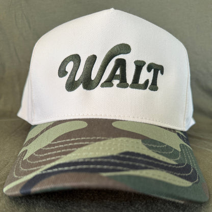 White cap with green embroidered 'WALT' text and camouflage pattern bill