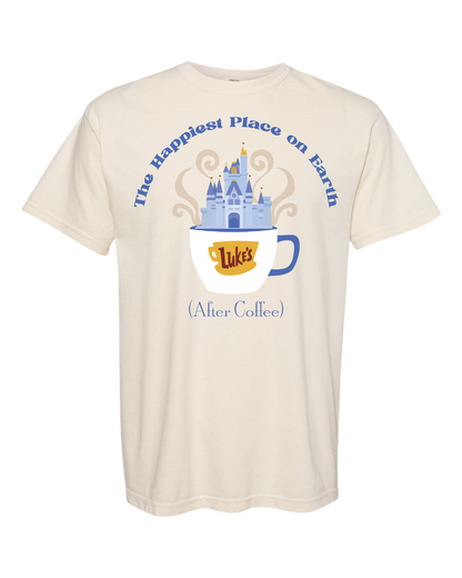 Cream t-shirt with blue castle and coffee cup graphic, text reads 'The Happiest Place on Earth (After Coffee)'.