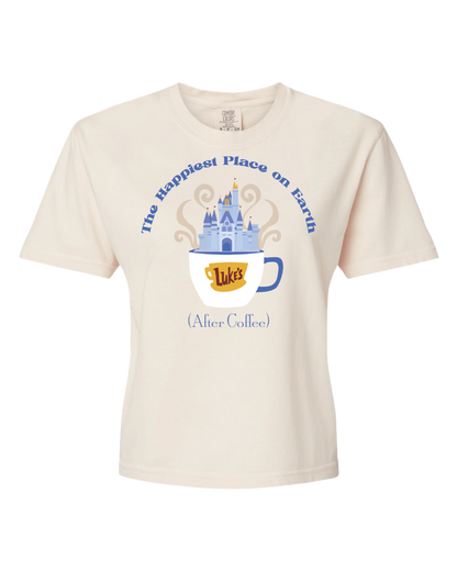 Cream t-shirt with a coffee cup, blue castle, and text The Happiest Place on Earth (After Coffee).